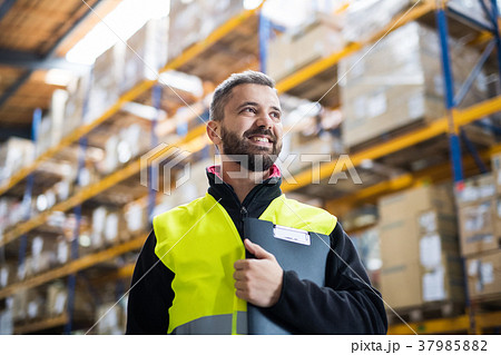 Male warehouse worker with clipboard. Male warehouse worker with clipboard. 37985882