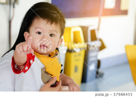 Asian child boys is pointing fingers innocently Asian child boys is pointing fingers innocently 37986455