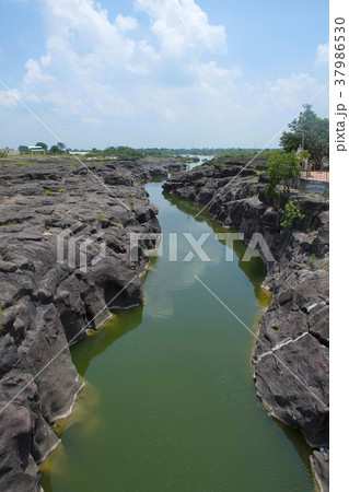 Naturally created potholes on the riverbed Naturally created potholes on the riverbed 37986530