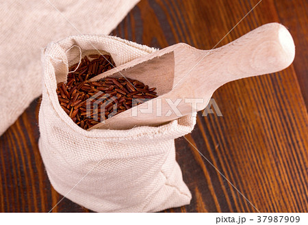 raw brown rice on sackcloth bag raw brown rice on sackcloth bag 37987909
