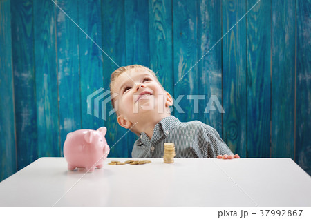 three years old child sitting st the table with 37992867