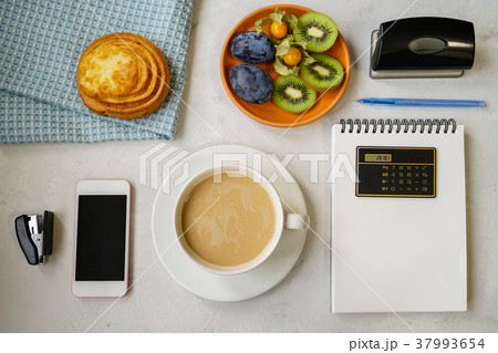 New Year's still life in the office. Bun, coffee  37993654