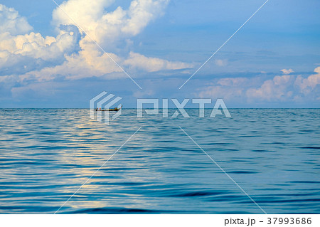 Fishermen sail their longtail boats out to sea Fishermen sail their longtail boats out to sea 37993686