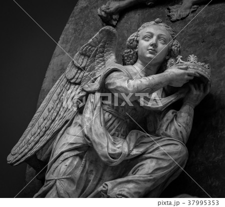 Detail of a stone angel on the facade of a Detail of a stone angel on the facade of a 37995353