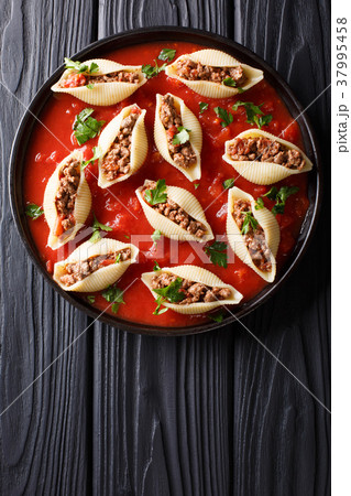 Shells pasta stuffed with ground beef with herbs 37995458