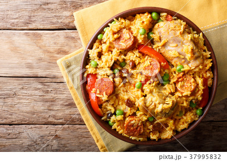 Arroz Valenciana with rice, meat, sausage, raisins 37995832
