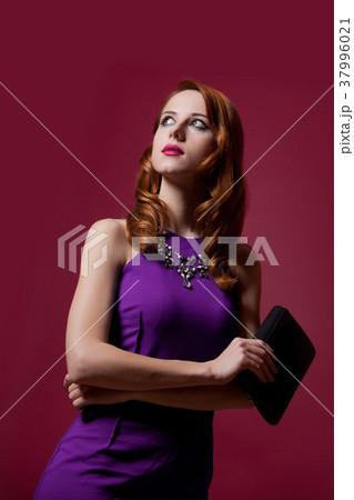 Portrait of young sexy woman in purple dress 37996021