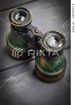 Old binoculars covered with patina. 38000414