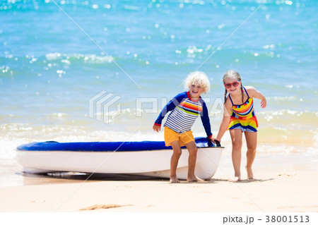 Kids kayaking in ocean. Children in kayak in sea 38001513