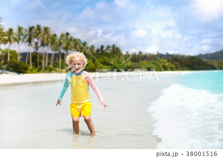 Child on tropical beach. Sea vacation with kids. Child on tropical beach. Sea vacation with kids. 38001516