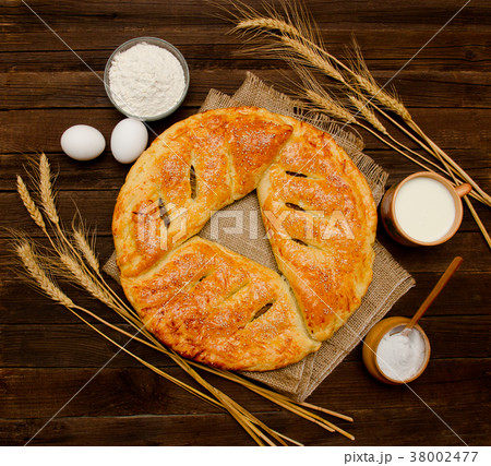 Pie, ingredients for baking, ears of wheat and mug Pie, ingredients for baking, ears of wheat and mug 38002477