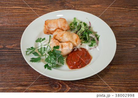 Roasted chicken breast fillet on a plate. Roasted chicken breast fillet on a plate. 38002998