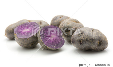 Fresh vitelotte potato isolated on white Fresh vitelotte potato isolated on white 38006010
