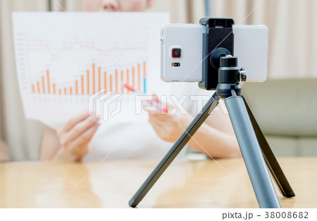 Businesswoman presenting financial stats  38008682