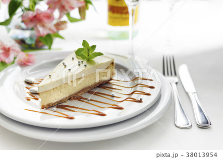 Pieces of delicious homemade cheesecake with mint 38013954