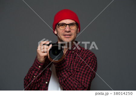 Positive male photographer with camera 38014250