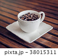 Coffee cup and coffee beans on wooden background 38015311