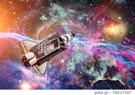 Space Shuttle over galaxy and space nebula. 38015567