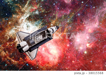 Space Shuttle over galaxy and space nebula. 38015568