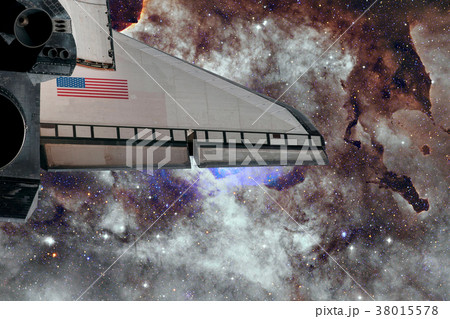 Space Shuttle flight over space nebula. 38015578