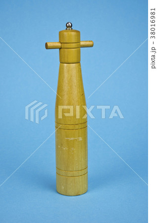 vintage wooden pepper grinder on blue background vintage wooden pepper grinder on blue background 38016981