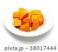 Cut papaya on white plate; white background.  38017444