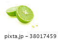 Splitted green limes and seeds on white background 38017459