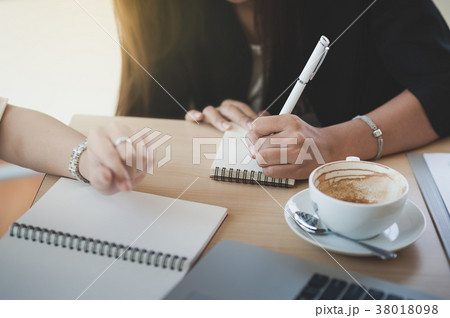 Two women participate business meeting 38018098