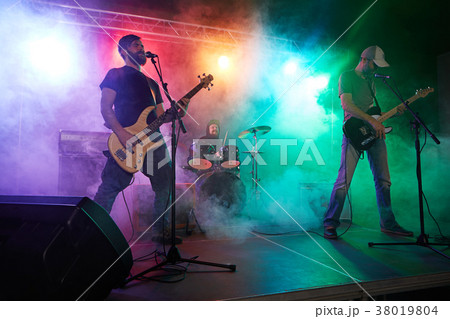 Bass player perform on stage. Bass player perform on stage. 38019804