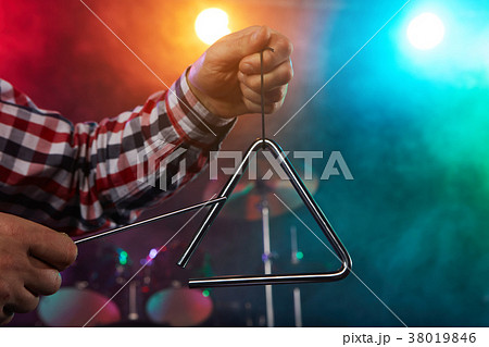 The drummer plays percussion. 38019846