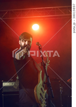 Bass player perform on stage. 38019897