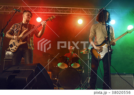 Rock band performs on stage. Rock band performs on stage. 38020556