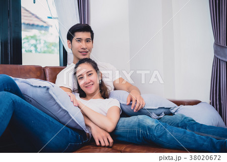 Asian young couples relaxing on sofa. Lovers and Couples concept Asian young couples relaxing on sofa. Lovers and Couples concept 38020672