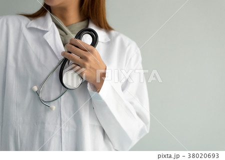 Female doctor holding stethoscope and hear heart 38020693