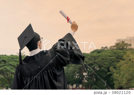 young man wear cap and gown graduation suit young man wear cap and gown graduation suit 38021120