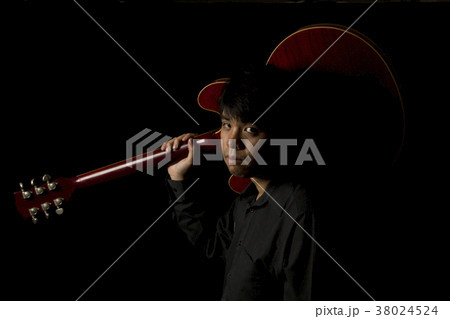 asian young musician playing guitar 38024524