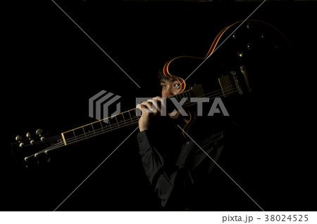 asian young musician playing guitar 38024525