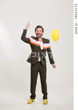 Happy man with yellow balloon 38025279
