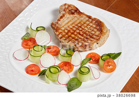 Grilled meat fillet steak with vegetables on plate 38026698