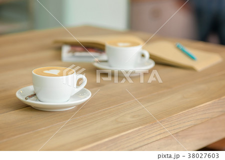 A table setting for coffee on the counter at a 38027603