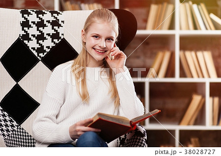Teenage girl in a library Teenage girl in a library 38028727