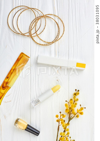 Cosmetics and jewelry, wooden background. 38031095