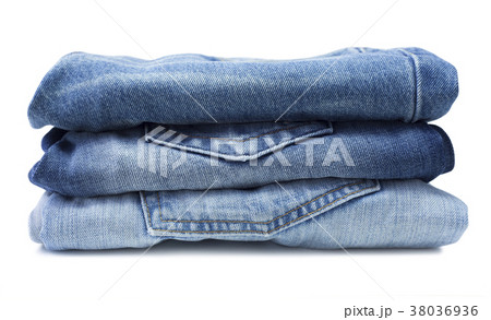 Stack of blue jeans isolated on white 38036936