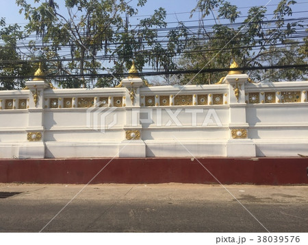Thai design on Buddhist temple walls in Thailand 38039576