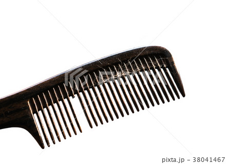 Old black comb and broken on a white background. 38041467