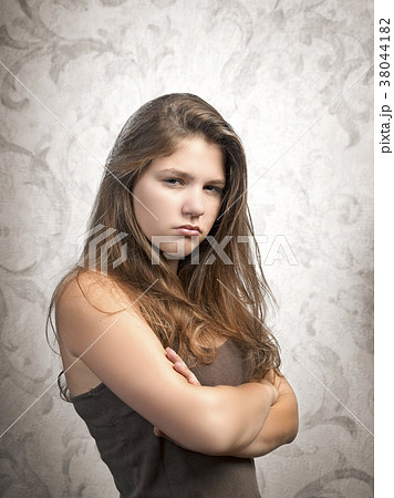Angry woman on a textured background 38044182