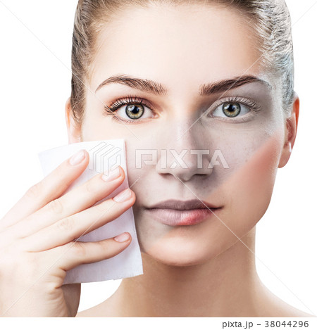Young woman cleaning her face by napkins. 38044296