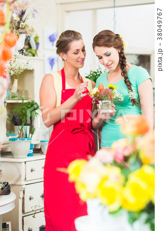Florist woman and customer in flower shop 38049767