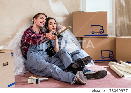 Young couple day dreaming about their future after Young couple day dreaming about their future after 38049977