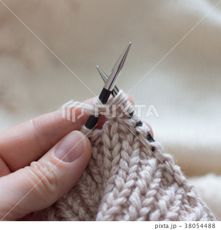 Lessons knitting by hand on needles and beige Lessons knitting by hand on needles and beige 38054488